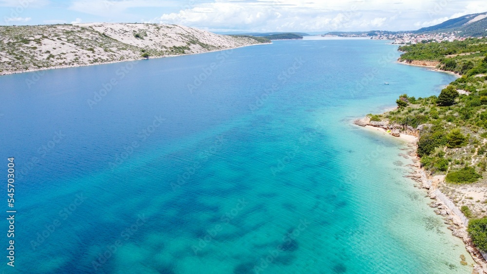 Aerial of the Australian Weissensee lake view with a shore and green trees