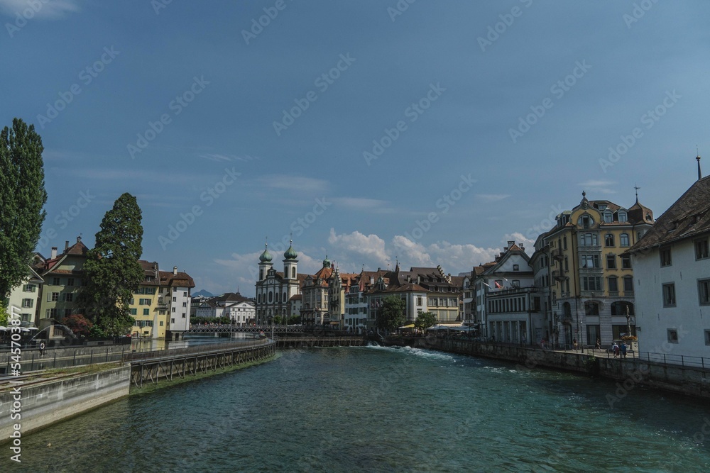 View of Reuss river surrounded by beautiful architecture of Lucerne, Switzerland