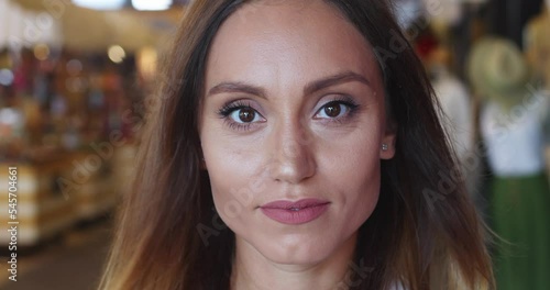 Wallpaper Mural Slow motion. Closeup of a stunning brunette woman in a shopping mall, spreading into a beautiful toothy smile, looking at camera with an insightful look. Lifestyle portrait of beautiful diverse people Torontodigital.ca