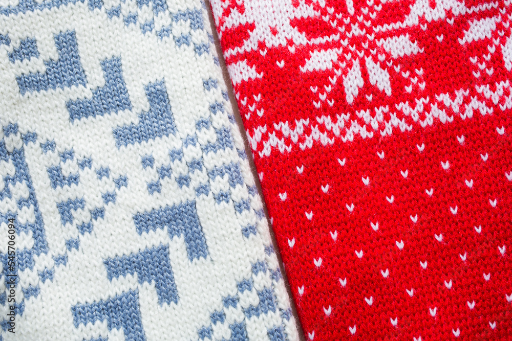 knitted red, white and blue wool background closeup. Christmas blanket or sweater knitted red, white and blue wool background closeup. Christmas blanket or sweater