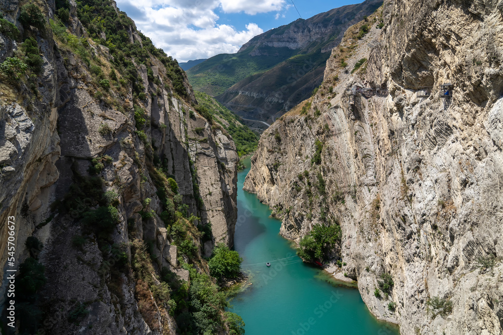 Turquoise river Sulak meandering through rocky forested landscape. Gorge of the mountain river