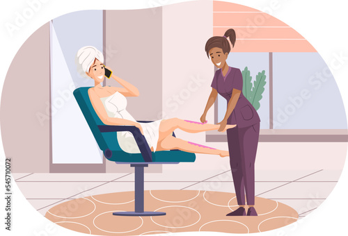 Beautician applying sugaring wax to leg of woman client.
