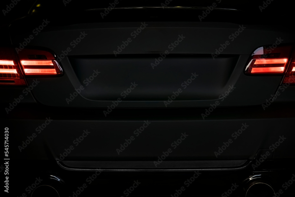 Sport tuned car rear view in the dark