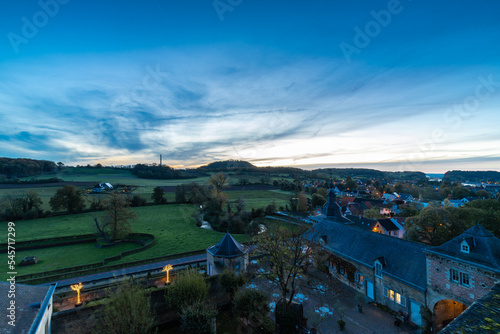 Overlooking the medieval event location of Neercanne just outside Maastricht and with a view over the Jeker valley during a spectacular autumn morning just after sunrise with amazing sun beams photo