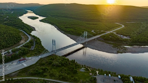 Sami Bridge and Teno river, summer, golden hour in Utsjoki photo