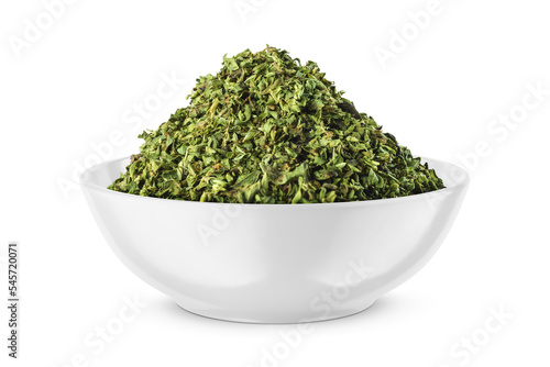 Dried oregano seasoning in round bowl isolated on white. Front view.