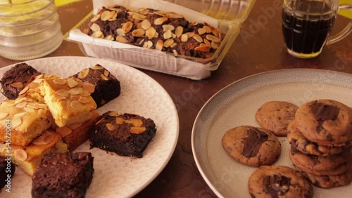 Sweets on plates: brownies, blondies, banana bread & cookies. photo