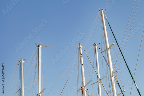 Masts tops and rope rigging accessory on yachts sailing vessels in the marina