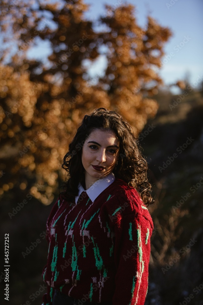 Beautiful young caucasian woman standing on the forest on a sunny day Beautiful young caucasian woman standing on the forest on a sunny day