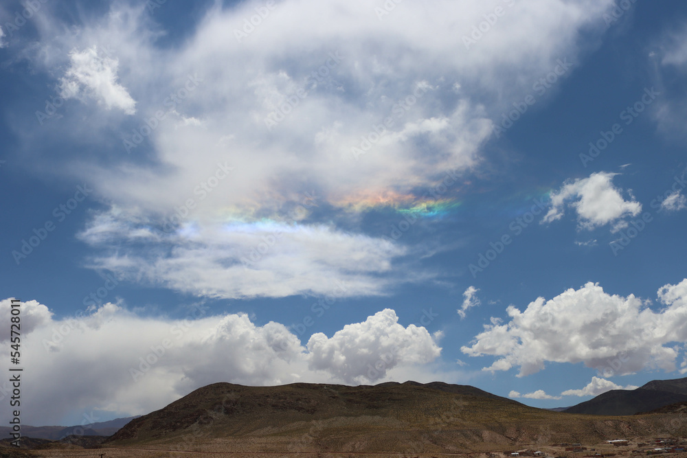 Reflection of light in the clouds forms a rainbow