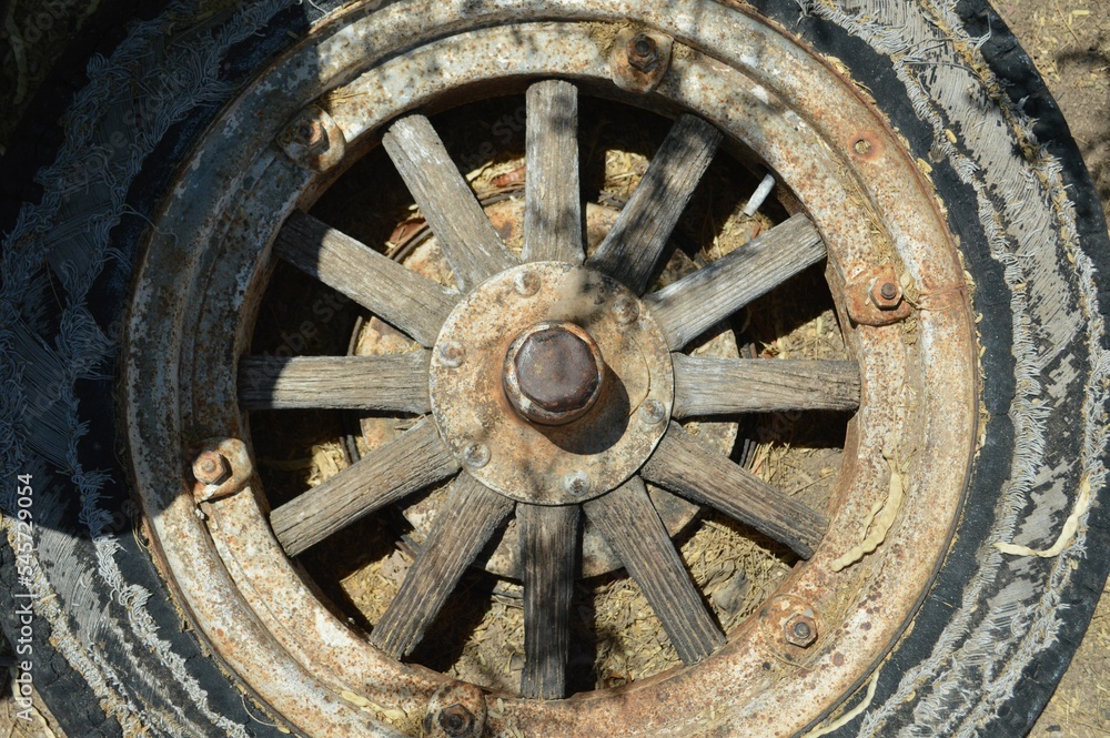 Old spoked tire and rim decaying in the desert