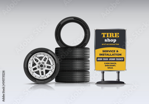 Tire set. Maintenance and installation. Side view of a car tire with an alloy wheel, caliper and brake disc. Portable billboard. Stack of rubber wheels. Wheel shop. Discounts, promotions.