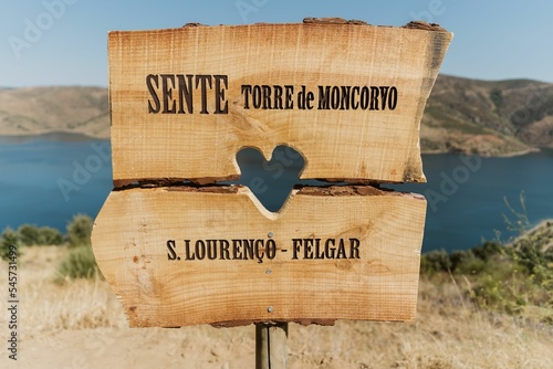 Closeup shot of wooden directional sign with writings Sente Torre de Moncorvo and S. Lorenco Felgar photo