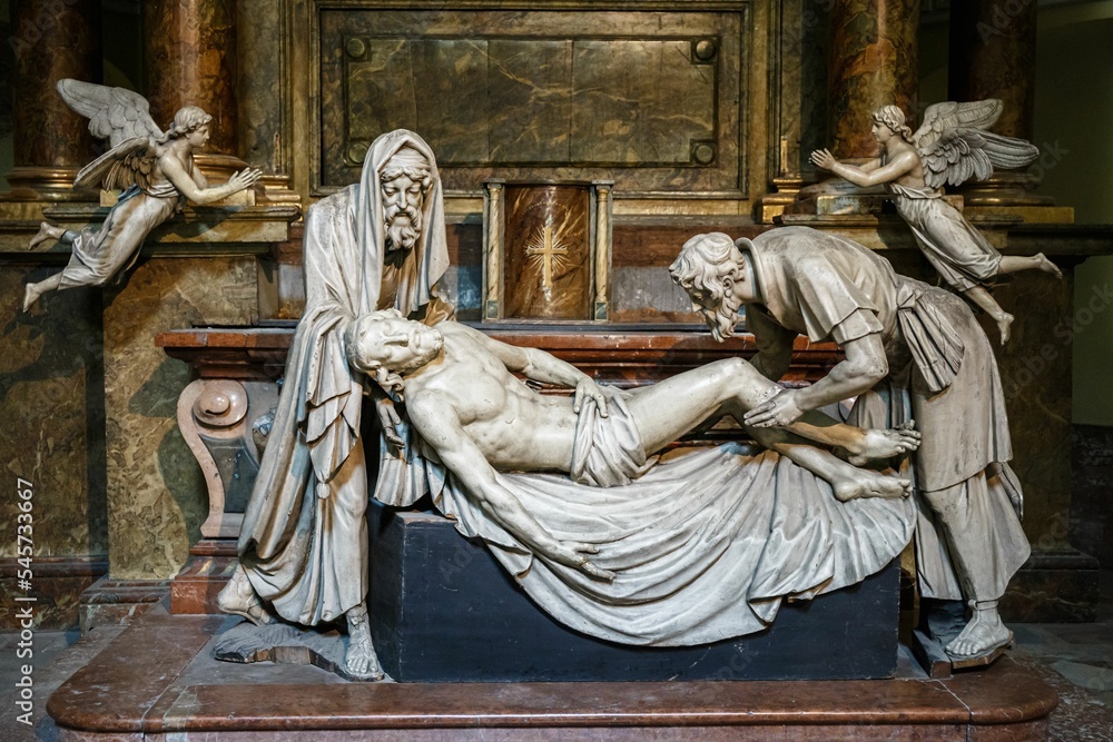 Fototapeta premium Beautiful statue of the burial of Jesus with Nicodemus and Joseph in Michaelerkirche, Vienna