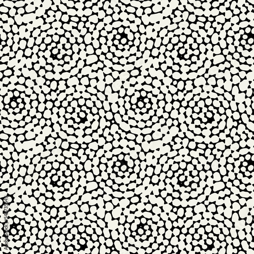 Vector seamless pattern. Free form organic shapes. Stylish structure of natural spots. Hand-drawn abstract background. Can be used as a tileable swatch. Monochrome spotty print.