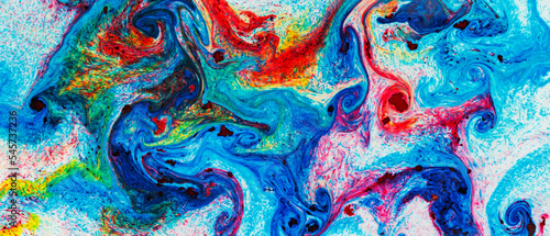 Fluid Art. Multicolored abstract background on the liquid. Trendy backdrop