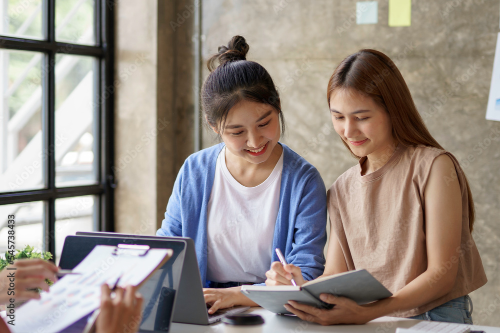 Group of young Asian business woman are meeting to present a new roadmap in product design with laptop computers in the office. Group of young Asian business woman are meeting to present a new roadmap in product design with laptop computers in the office.