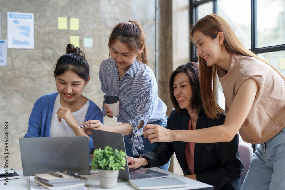 Group of young Asian business woman are meeting to present a new roadmap in product design with laptop computers in the office. Group of young Asian business woman are meeting to present a new roadmap in product design with laptop computers in the office.