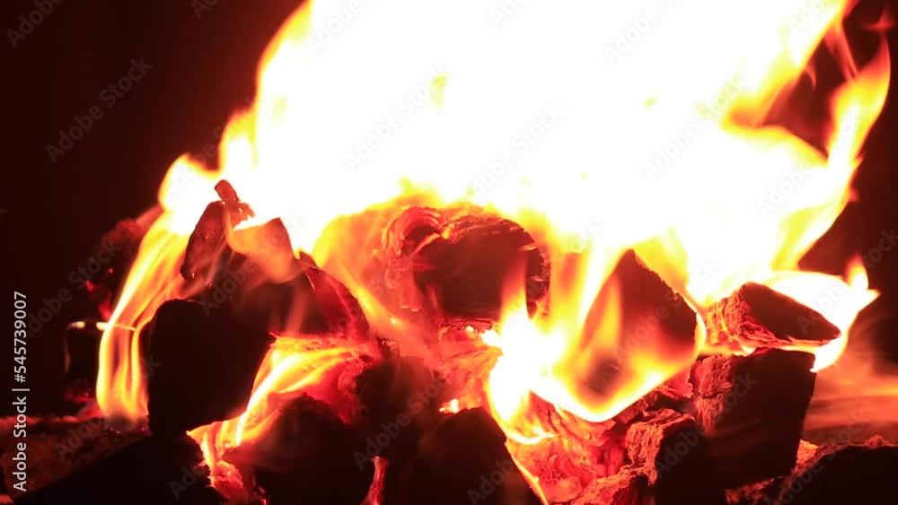 Firewood is burning in the fireplace Firewood is burning in the fireplace