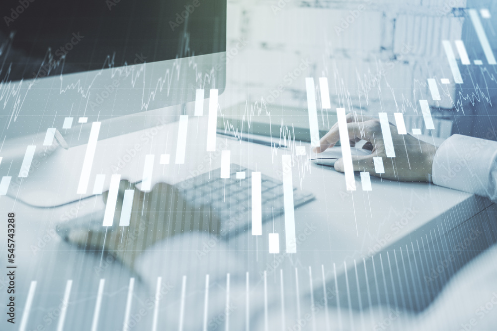 Abstract creative financial graph with hand typing on laptop on background, forex and investment concept. Multiexposure Abstract creative financial graph with hand typing on laptop on background, forex and investment concept. Multiexposure