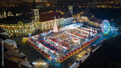 Landscape photography of Sibiu city center with the Christmas Fair  shot from a drone at sunset with the city lightning on. Birds eye view over cityscape of Sibiu  Romania.