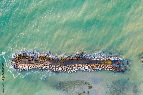 Wave breakers in a summer resort viewed from above