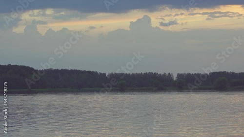 lake in the evening after sunset. Quiet lake after sunset. Steam rising from the water. 4k photo