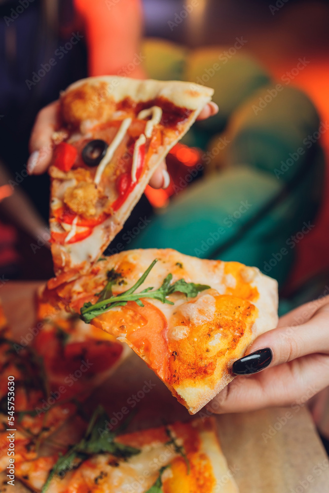 Eating Pizza. Group Of Friends Sharing Pizza Together. People Hands Taking  Slices Of Pepperoni Pizza. Fast Food, Friendship, Leisure, Lifestyle. Stock  Photo