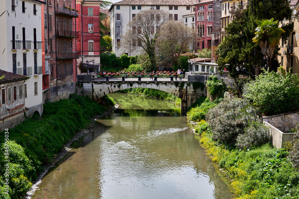 Retrone river crossing Vicenza, in the background Ponte di San Paolo, Veneto, Italy