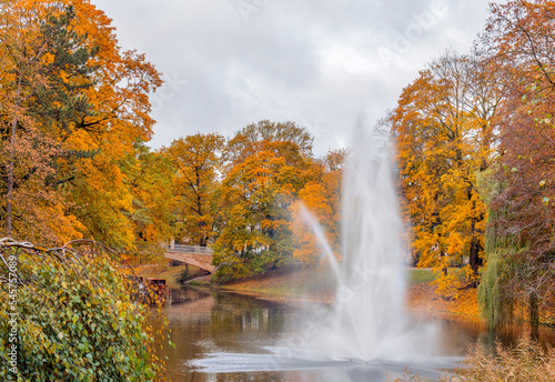 Decorative fountain and water cascade in autumnal park in Riga, capital city of Latvia © sergei_fish13