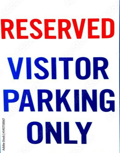 Reserved vistor parking sign.