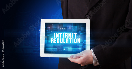 Wallpaper Mural Person holding tablet, security concept Torontodigital.ca