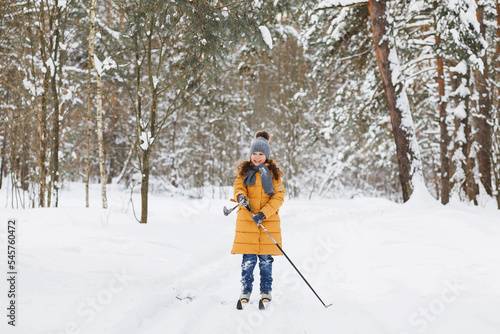 Girl skiing in the forest