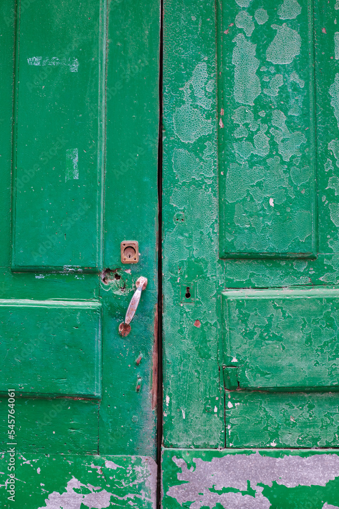 Old, picturesque main front door in mediterranean region house. Old, picturesque main front door in mediterranean region house.