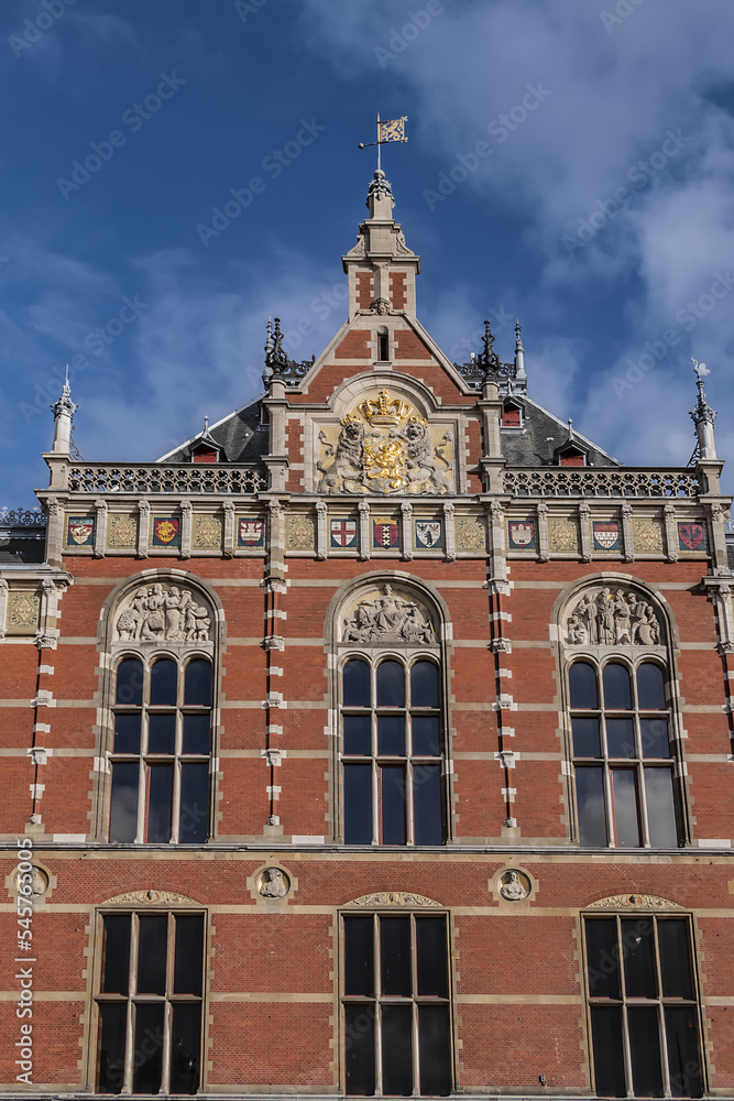 Architectural fragments of historic building of Amsterdam central railway station (opened in 1889). Amsterdam, the Netherlands.