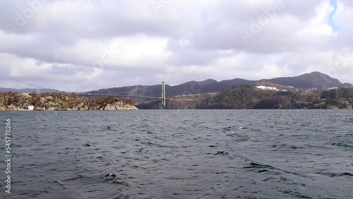 sea with bridge mountains norway photo