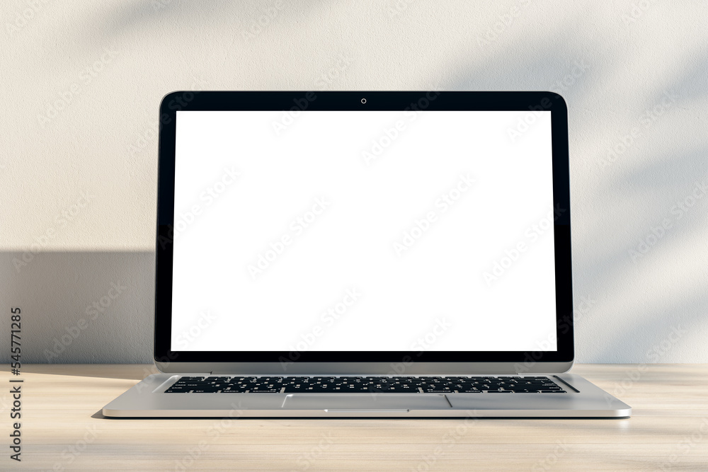 Closeup of modern laptop with blank white screen and place for your logo or text on light wooden table and sunlit wall background. 3D rendering, mock up Closeup of modern laptop with blank white screen and place for your logo or text on light wooden table and sunlit wall background. 3D rendering, mock up