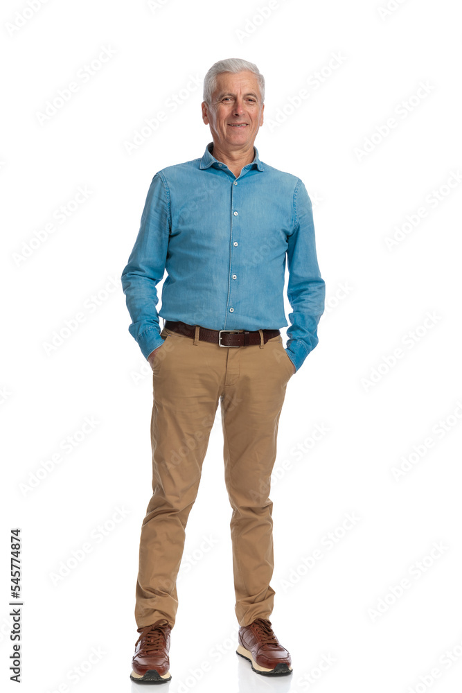 happy old man holding hands in pockets and smiling happy old man holding hands in pockets and smiling