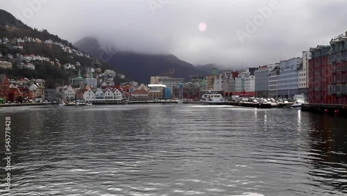 bergen norway sea port with mountains cloudy day photo