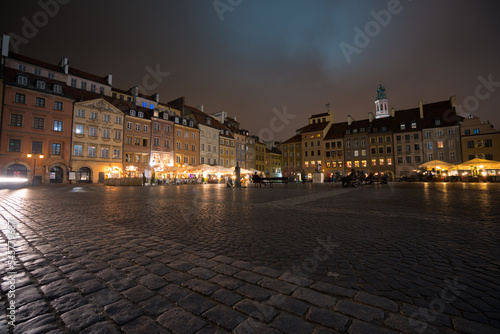 Wallpaper Mural Market square of the old town in the city of Warsaw, Poland during the evening. Surounded by colorfull buildings in Rynek Starego Miasta. Torontodigital.ca