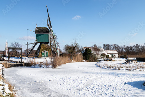 Windmill - De Trouwe Waghter, in the wintry polder landscape near the Dutch village of Tienhoven.