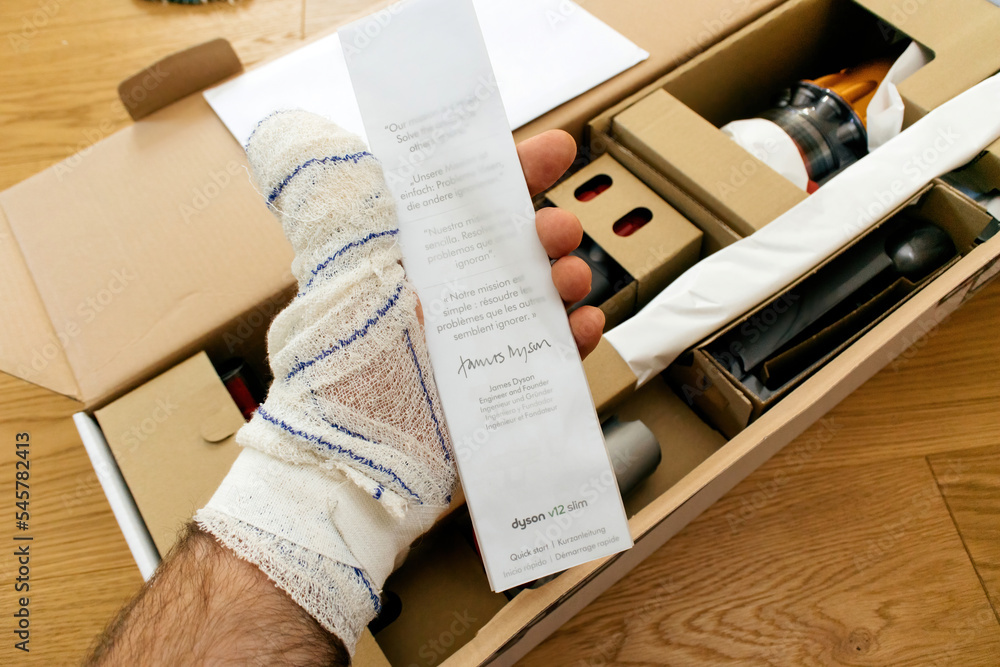 Paris, France - Jul 4, 2022: Man hand holding during unboxing quick ...