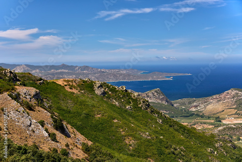 Panorama from Col de Teghime, green hills and Mediterranean sea in the background, Landscape od Cap Corse in Corsica photo