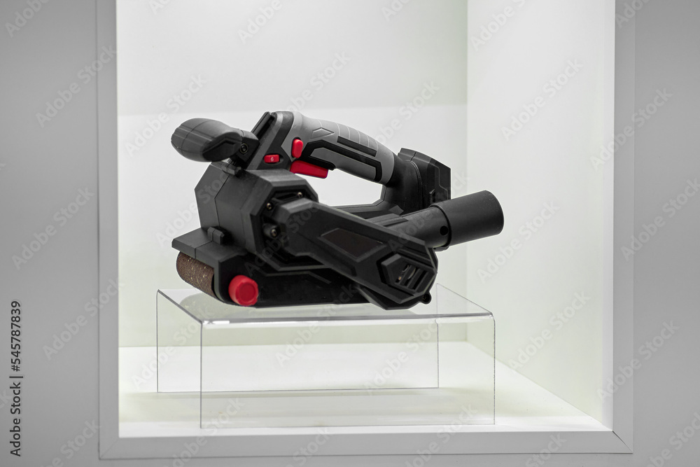 A professional tool for work, repair and construction in the store. Sale of wired power tools and battery powered equipment in the shop A professional tool for work, repair and construction in the store. Sale of wired power tools and battery powered equipment in the shop