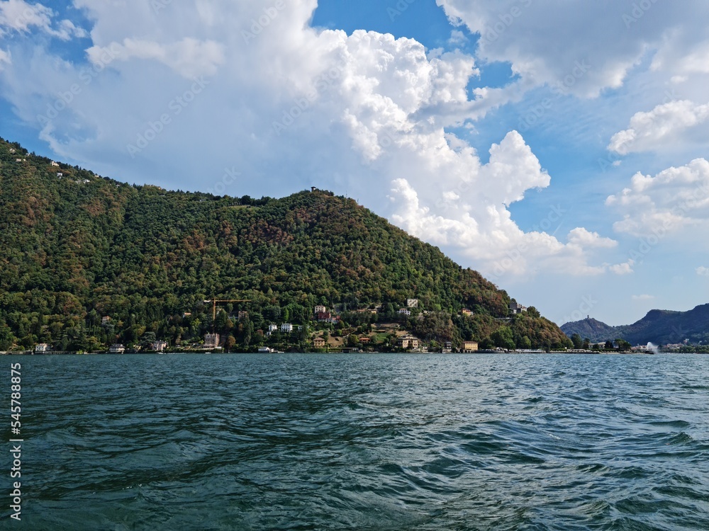 Lake Como country on a summer sunny day. View of the bay. Lake Como and mountains. Scenic view of the resort town. Beautiful Italian landscape. Lake Como country on a summer sunny day. View of the bay. Lake Como and mountains. Scenic view of the resort town. Beautiful Italian landscape.