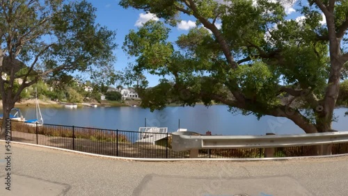 Side driving view of scenic Lake Sherwood and Hidden Valley near Westlake Village and Thousand Oaks in Ventura County, California. photo