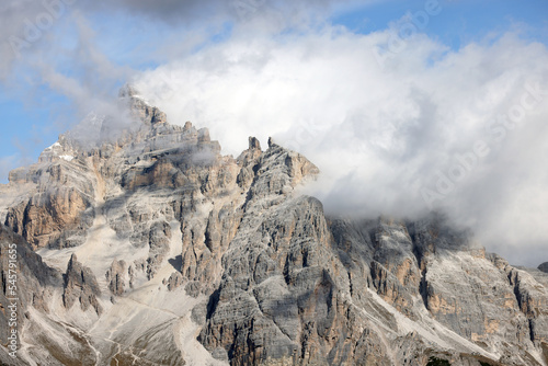 View of Tofane mountains on the background seen from Falzarego pass in an autumn landscape in Dolomites, Italy.