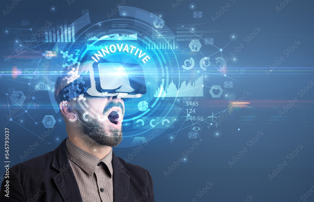 Businessman looking through VR glasses Businessman looking through VR glasses