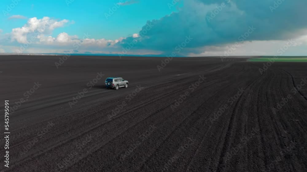 SUV car is fast going on rural road. Drone is following to a car SUV car is fast going on rural road. Drone is following to a car