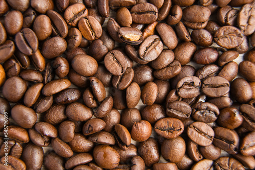 Closeup of brown roasted coffee beans background